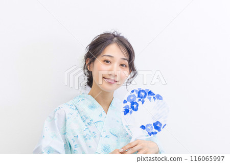 A young woman in a yukata white background A young woman in a yukata white background 116065997