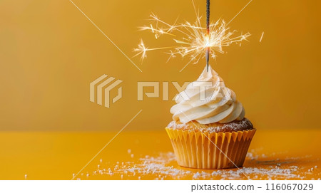 A cupcake with a sparkler on top, ready to be lit A cupcake with a sparkler on top, ready to be lit 116067029