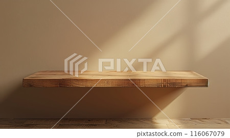A wooden table with a shadow on the wall 116067079