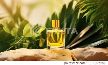 Transparent yellow glass perfume bottle mockup with plants on background. Eau de toilette. Mockup, spring flat lay. Transparent yellow glass perfume bottle mockup with plants on background. Eau de toilette. Mockup, spring flat lay. 116067482