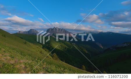 Breathtaking view of the Chertovy Vorota or Acheshboki mountains. Republic of Adygea, Russia. The image shows the untouched beauty of nature with a panoramic view of mountains, forest and greenery. 116071200