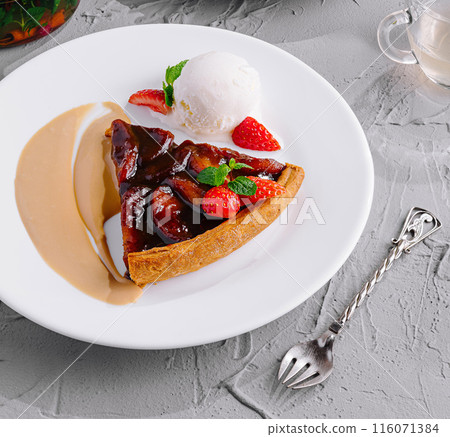 Gourmet dessert selection on elegant table setting 116071384