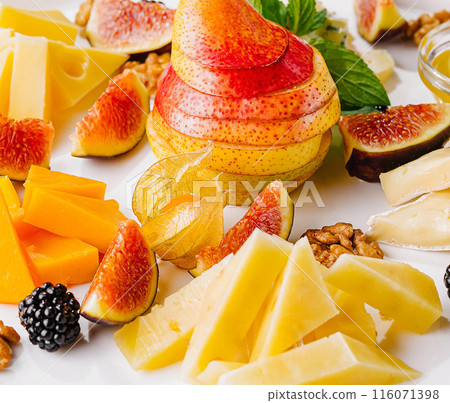 Gourmet cheese and fruit platter close up Gourmet cheese and fruit platter close up 116071398