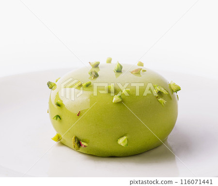 Elegant green apple dessert on white plate Elegant green apple dessert on white plate 116071441
