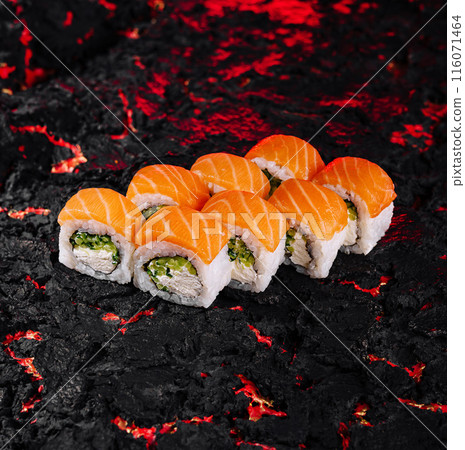 Sushi roll on textured black surface Sushi roll on textured black surface 116071464
