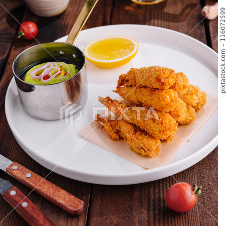 Fried shrimp platter with dipping sauce top view 116072599