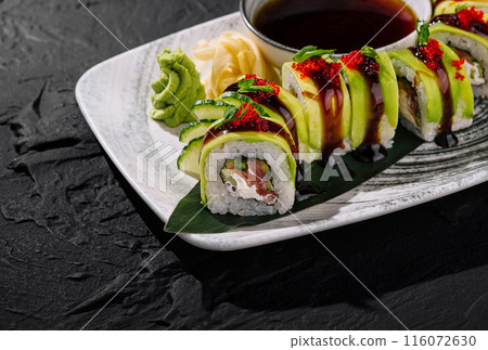 Exquisite avocado sushi roll on elegant plate 116072630