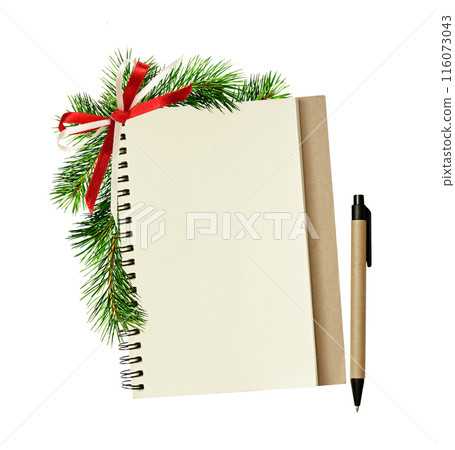 Empty notebook and pen with Christmas decorations isolated on white. Holiday template. Empty notebook and pen with Christmas decorations isolated on white. Holiday template. 116073043