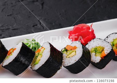Elegant sushi platter on dark surface 116073198