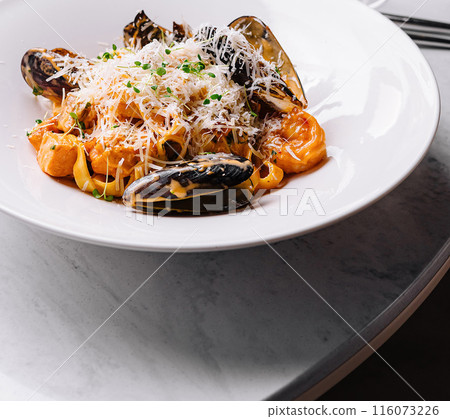 Elegant seafood pasta dish on festive table 116073226