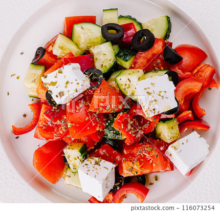 Fresh greek salad on white plate 116073254