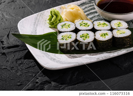 Fresh avocado sushi roll on slate background 116073316