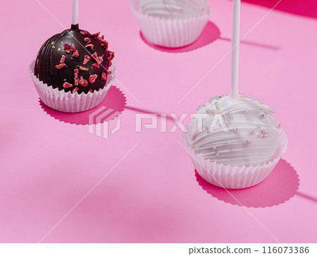 Gourmet chocolate cake pops on pink background 116073386