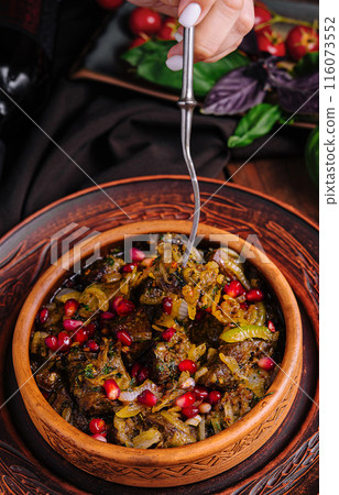 Traditional ceramic bowl with eggplant stew and pomegranate Traditional ceramic bowl with eggplant stew and pomegranate 116073552