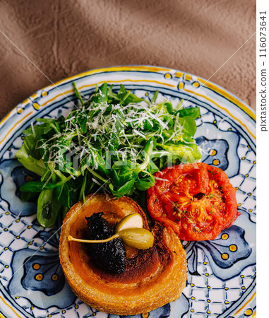 Gourmet toast with fresh toppings on artistic plate Gourmet toast with fresh toppings on artistic plate 116073641