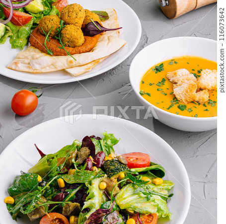 Fresh vegetarian salad and soup meal setup Fresh vegetarian salad and soup meal setup 116073642