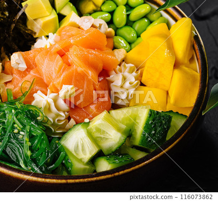 Fresh salmon poke bowl with vegetables and rice 116073862