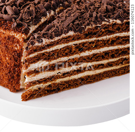Chocolate layer cake slice on white plate Chocolate layer cake slice on white plate 116074123