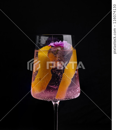 Elegant cocktail with floral garnish 116074130