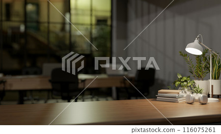 A copy space for displaying products on a wooden table in a modern office at night. 116075261