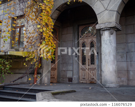 Architecture of the old area. Facade of an old building. Cozy place. 116076529