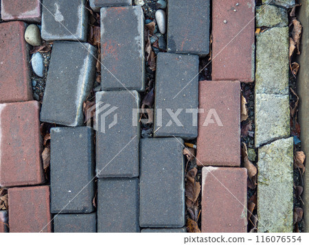 Broken paving stone. Broken pavement stones. Poor quality work.  The need for repair 116076554