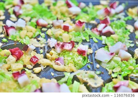 Takoyaki made on a takoyaki plate Takoyaki made on a takoyaki plate 116076836