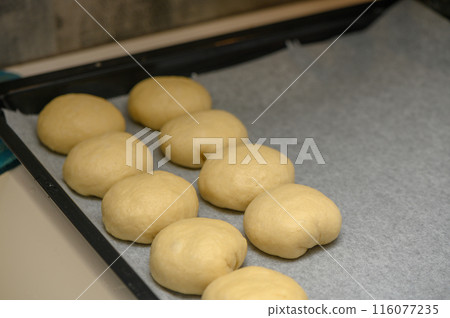 bun blanks on a baking sheet 6 116077235