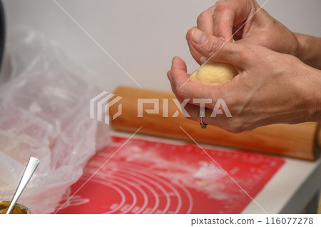 woman making buns in the kitchen 2 woman making buns in the kitchen 2 116077278