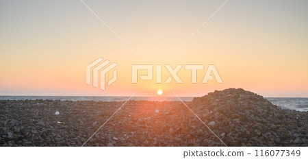 Sunset in Cyprus. beach. Embankment with piers. Cyprus on summer evening Sunset in Cyprus. beach. Embankment with piers. Cyprus on summer evening 116077349
