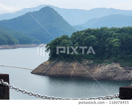 The dam lake has less water than usual The dam lake has less water than usual 116078455