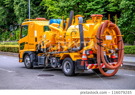 Yokohama cityscape in Japan - A view of industrial waste collection vehicles driving through the city - June 27, Yokohama city (just before the entrance to Nakagawa Station) Yokohama cityscape in Japan - A view of industrial waste collection vehicles driving through the city - June 27, Yokohama city (just before the entrance to Nakagawa Station) 116079285