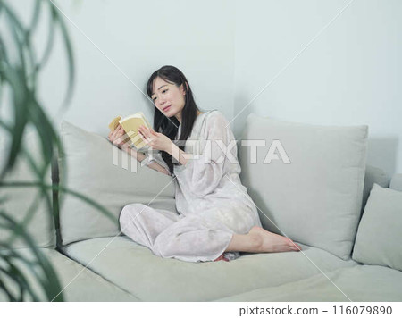 A woman reading A woman reading 116079890