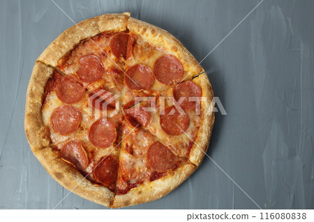 Round pepperoni pizza on a gray background Upper angle with space for copyspace text. Pizza Day Round pepperoni pizza on a gray background Upper angle with space for copyspace text. Pizza Day 116080838