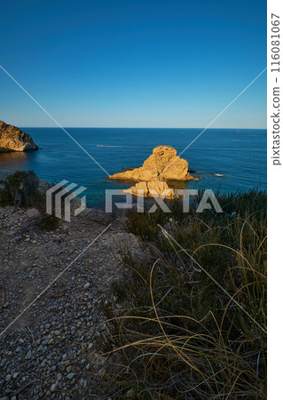 rocky beach at sunset rocky beach at sunset 116081067