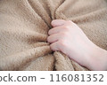 Hands holding a blanket 116081352