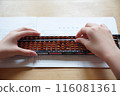 Hands using an abacus 116081361