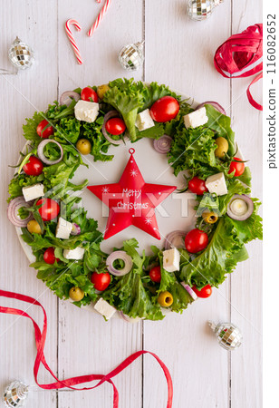 Christmas wreath salad on dark background Christmas wreath salad on dark background 116082652