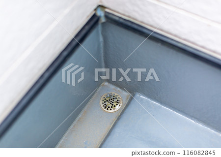 A balcony dirty with moss and dust A balcony dirty with moss and dust 116082845