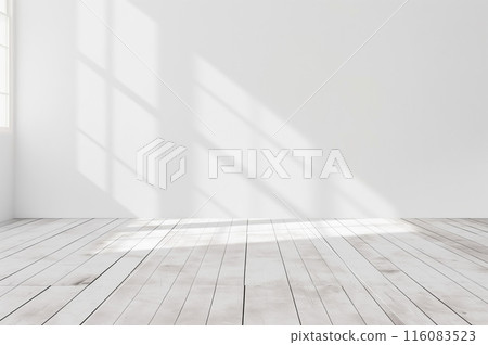 The interior of a white-toned building with sunlight streaming in 116083523