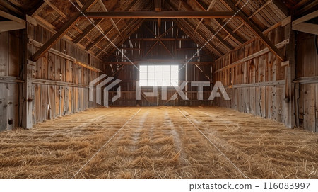 Old empty barn interior with with hay on the floor, sunlight shining through the window. 116083997