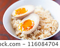 Put a soft-boiled egg on rice 116084704