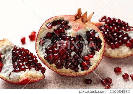 Pomegranate. Fresh organic juicy pomegranate fruit pieces. Pomegranate seeds, grains. 116084983