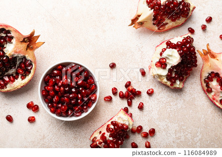 Pomegranate. Fresh organic juicy pomegranate fruit pieces. Pomegranate seeds, grains, top view. Pomegranate. Fresh organic juicy pomegranate fruit pieces. Pomegranate seeds, grains, top view. 116084989