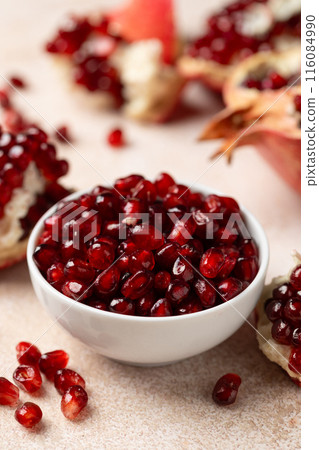 Pomegranate. Fresh organic juicy pomegranate fruit pieces. Pomegranate seeds, grains. Pomegranate. Fresh organic juicy pomegranate fruit pieces. Pomegranate seeds, grains. 116084990