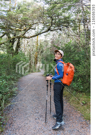 Asian woman with backpack hiking on wilderness in national park 116086393
