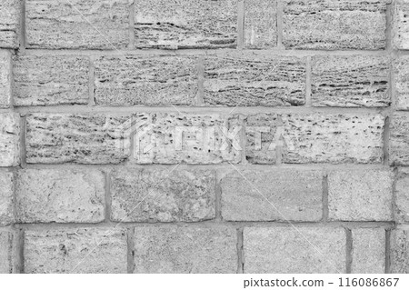 Grey brick blocks of sand shell limestone white natural texture wall background 116086867