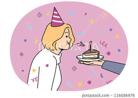 Birthday woman blows out candle on piece of cake celebrating anniversary and making cherished wish Birthday woman blows out candle on piece of cake celebrating anniversary and making cherished wish 116086976