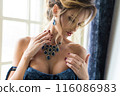Beautiful woman in an expensive necklace close-up. 116086983