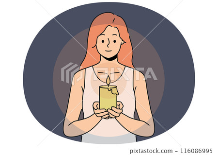 Woman with candle in hands looks at fire, performing religious ritual or seance. Woman with candle in hands looks at fire, performing religious ritual or seance. 116086995